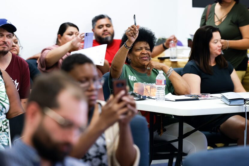 Diane Smith with Citizens for Environmental Justice raises her hand to ask a question during...