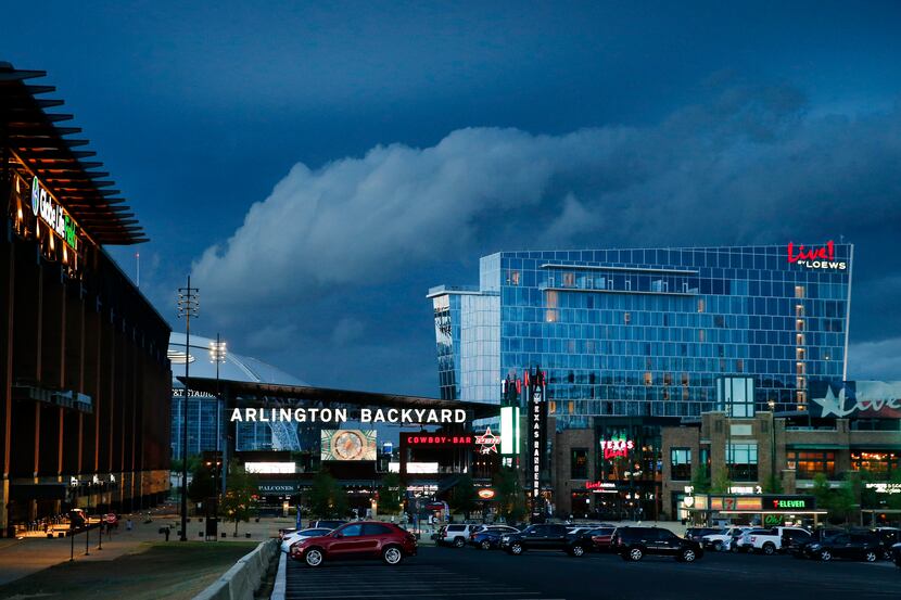 Clouds associated with a warned thunderstorm roll over the Texas Live! entertainment venue...