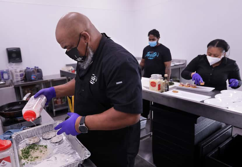 Kevin Johnson, left, prepares food with Niqholas Smedley and Mariam Goba for a wedding...