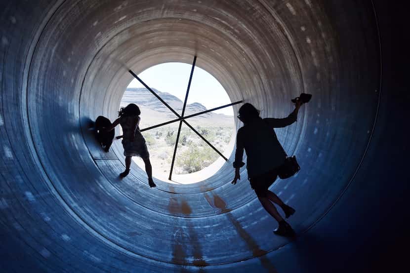 People walk through a hyperloop tube after the first test of a propulsion system at the...
