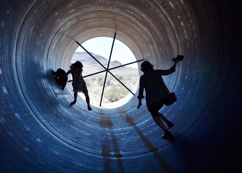 People walk through a hyperloop tube after the first test of a propulsion system at the...