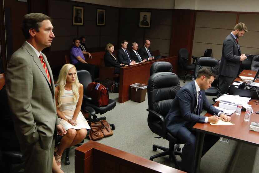 Tomi Lahren listened as her attorneys Brian Lauren (left) and Chris Simmons (center)...