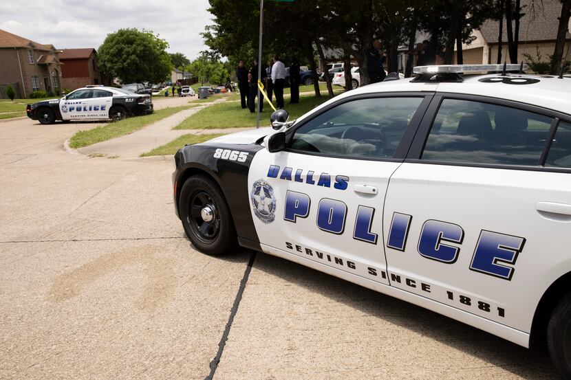 Dallas Police and members of the FBI investigate the scene where a toddler was found dead...
