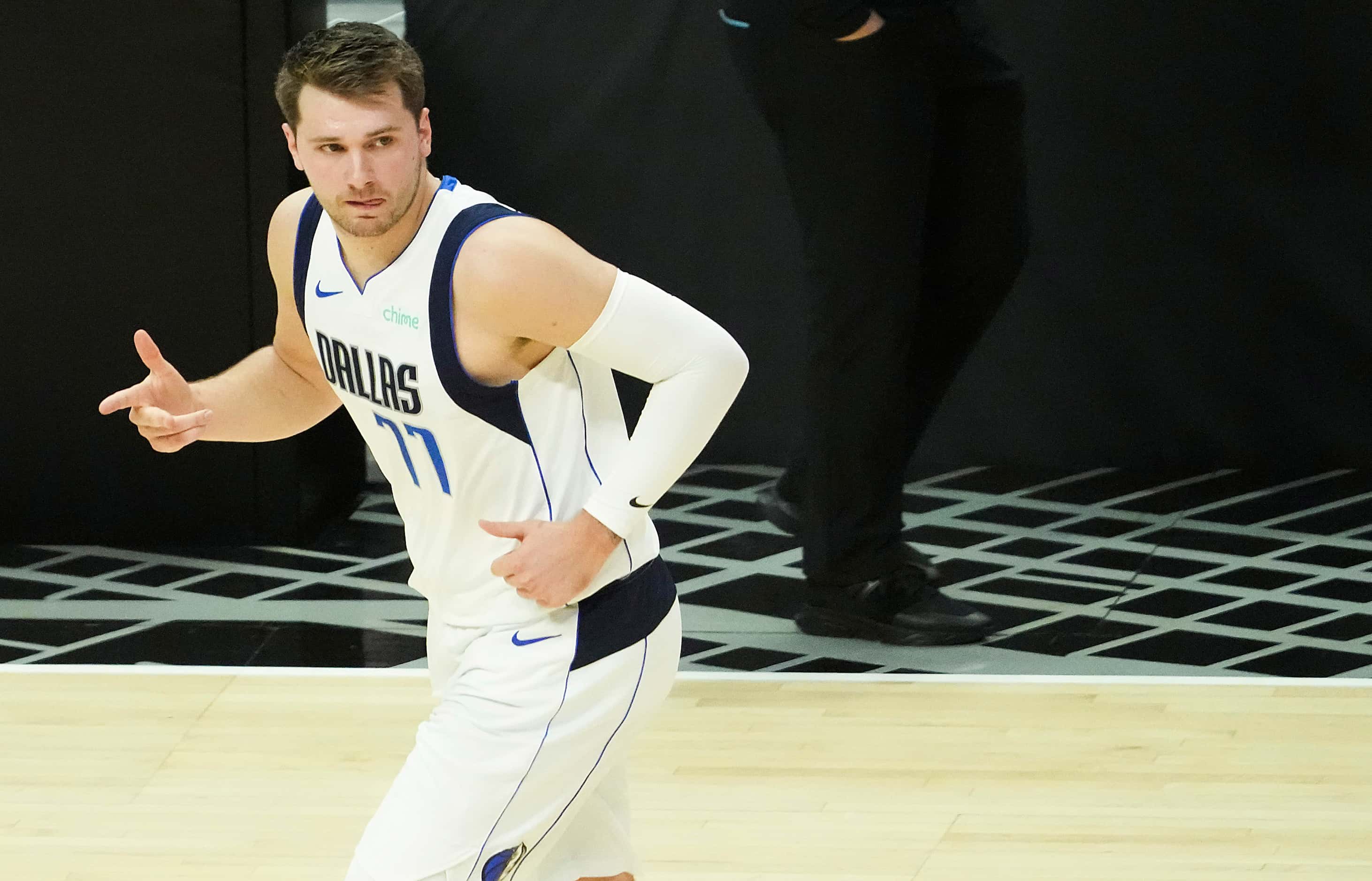 Dallas Mavericks guard Luka Doncic celebrates a 3-pointer during the first quarter of Game 7...