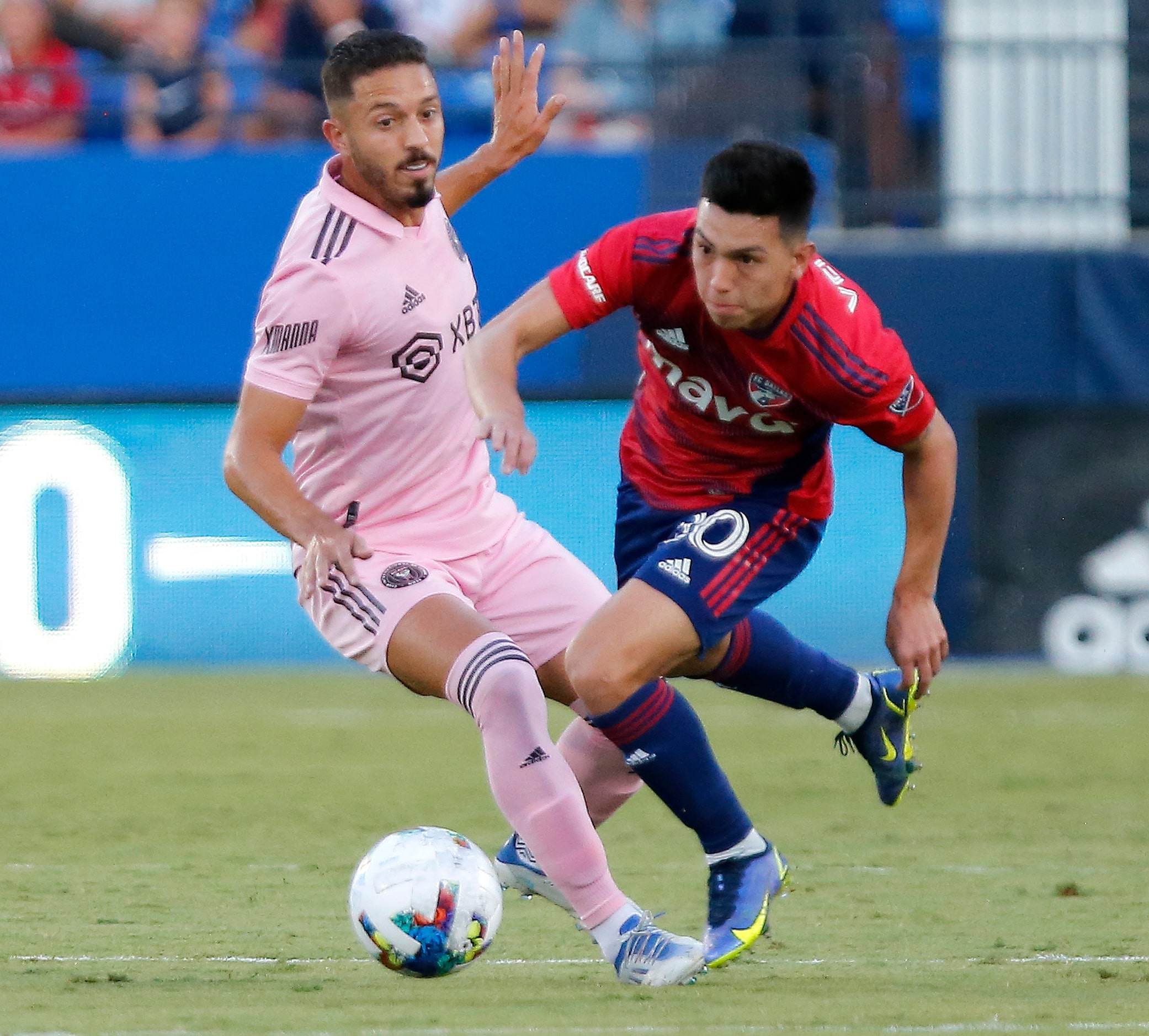 FC Dallas forward Alan Velasco (20) avoids a colision with Inter Miami midfielder Jean Mota...