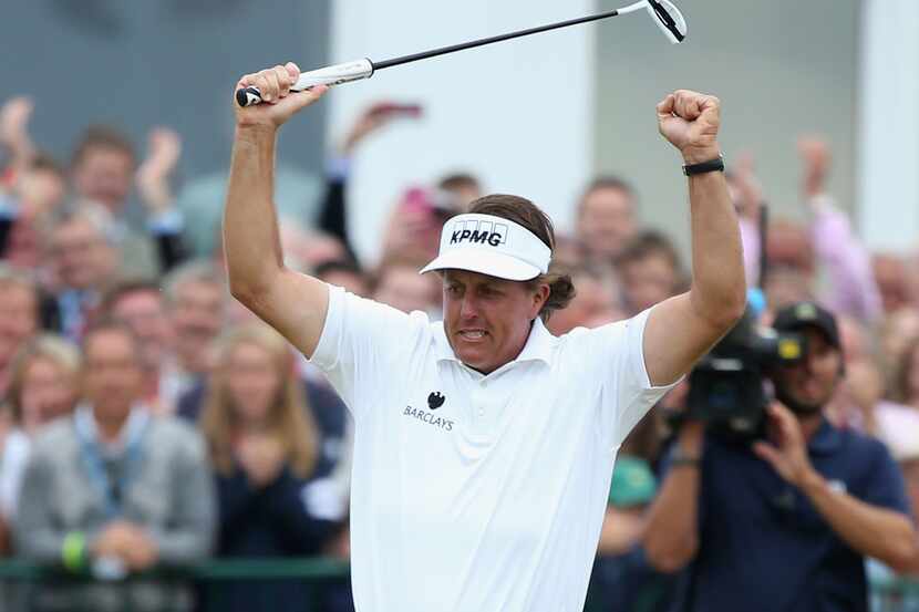 GULLANE, SCOTLAND - JULY 21:  Phil Mickelson of the United States reacts to a birdie putt on...