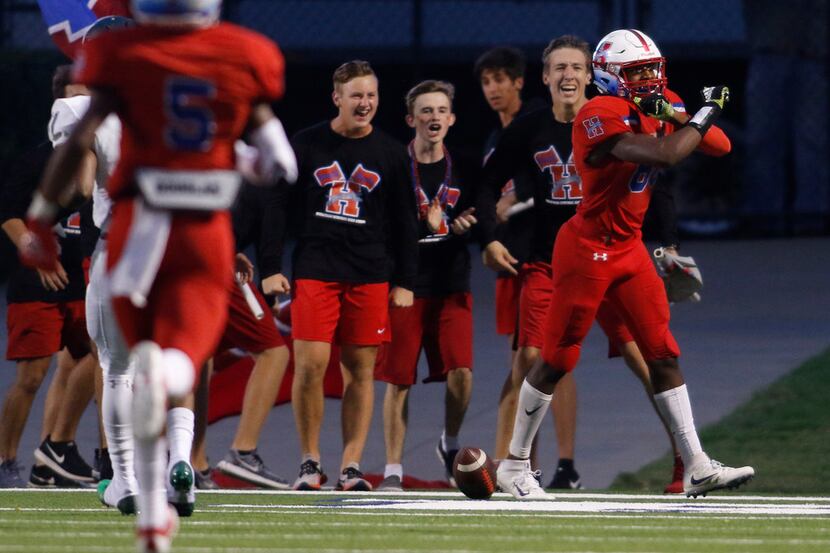 Midlothian Heritage receiver Langston Anderson (88) gestures to the team bench as student...