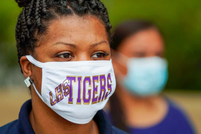 Quintessa Antoine wore a face mask in support of the Lincoln High School Tigers as she...
