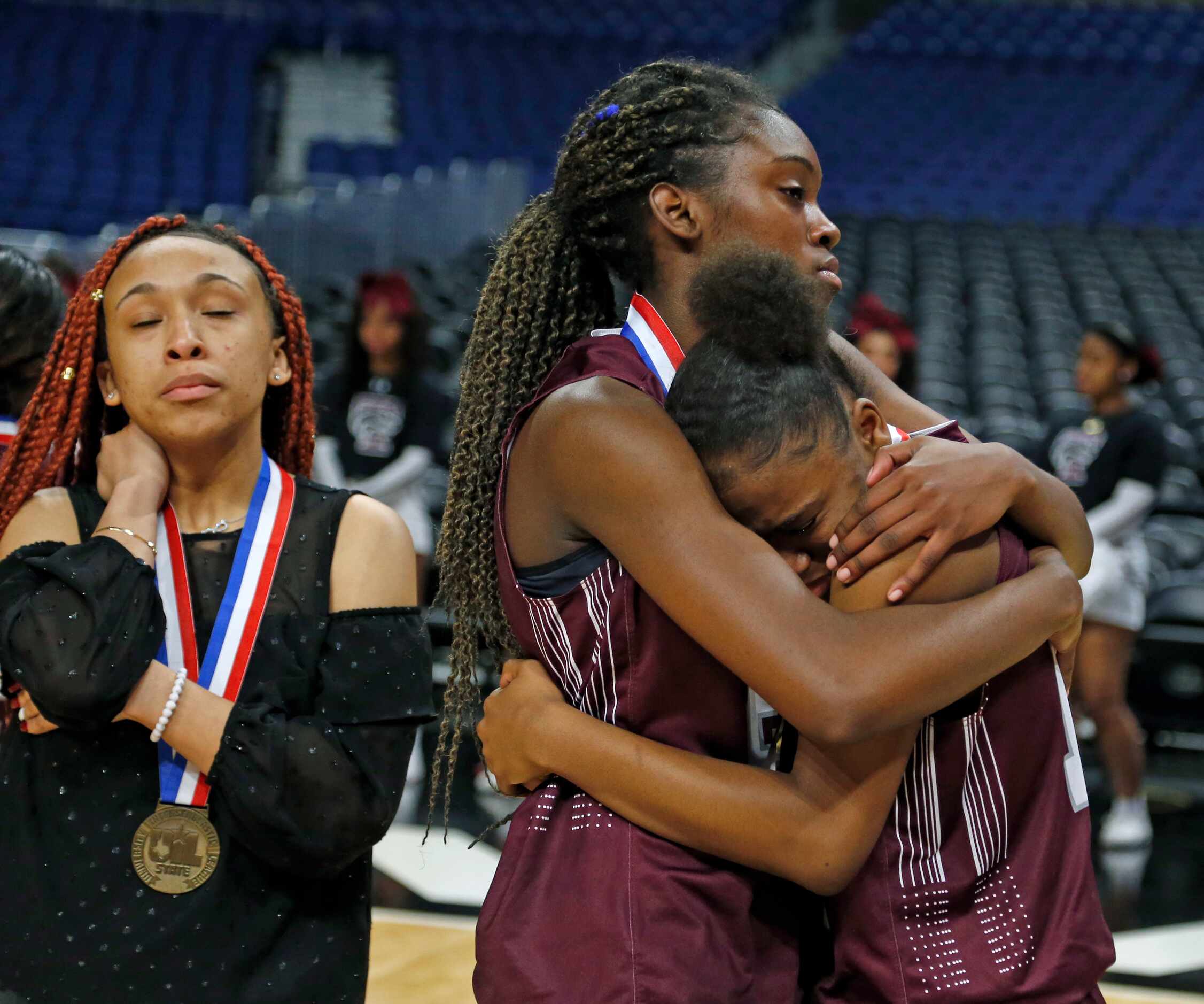 After receiving their medals Mansfield Timberview Forward Stephanie Mosley #21,center,...