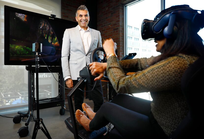 Toyota Connected CEO Steve Basra watches as Shravanthi Denthumdas, the company's vice...