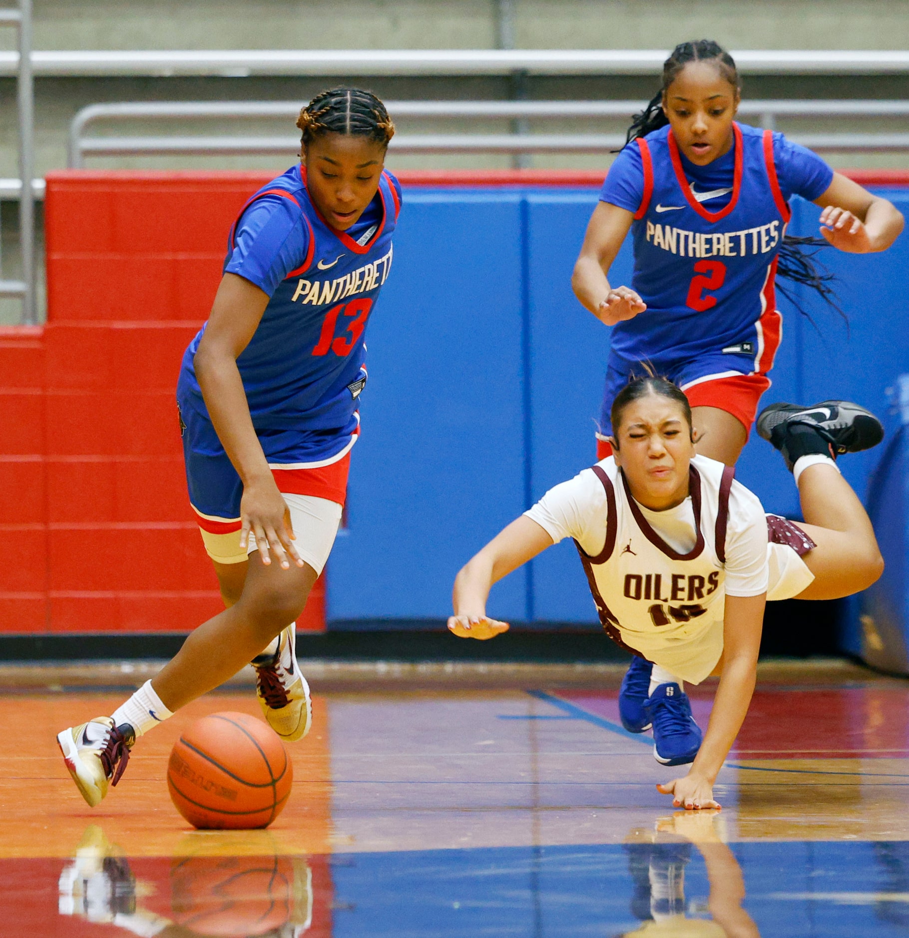 Duncanville's Samari Holmen (13) and Pearland's Brylee Bonner (10) battle for a loose ball...