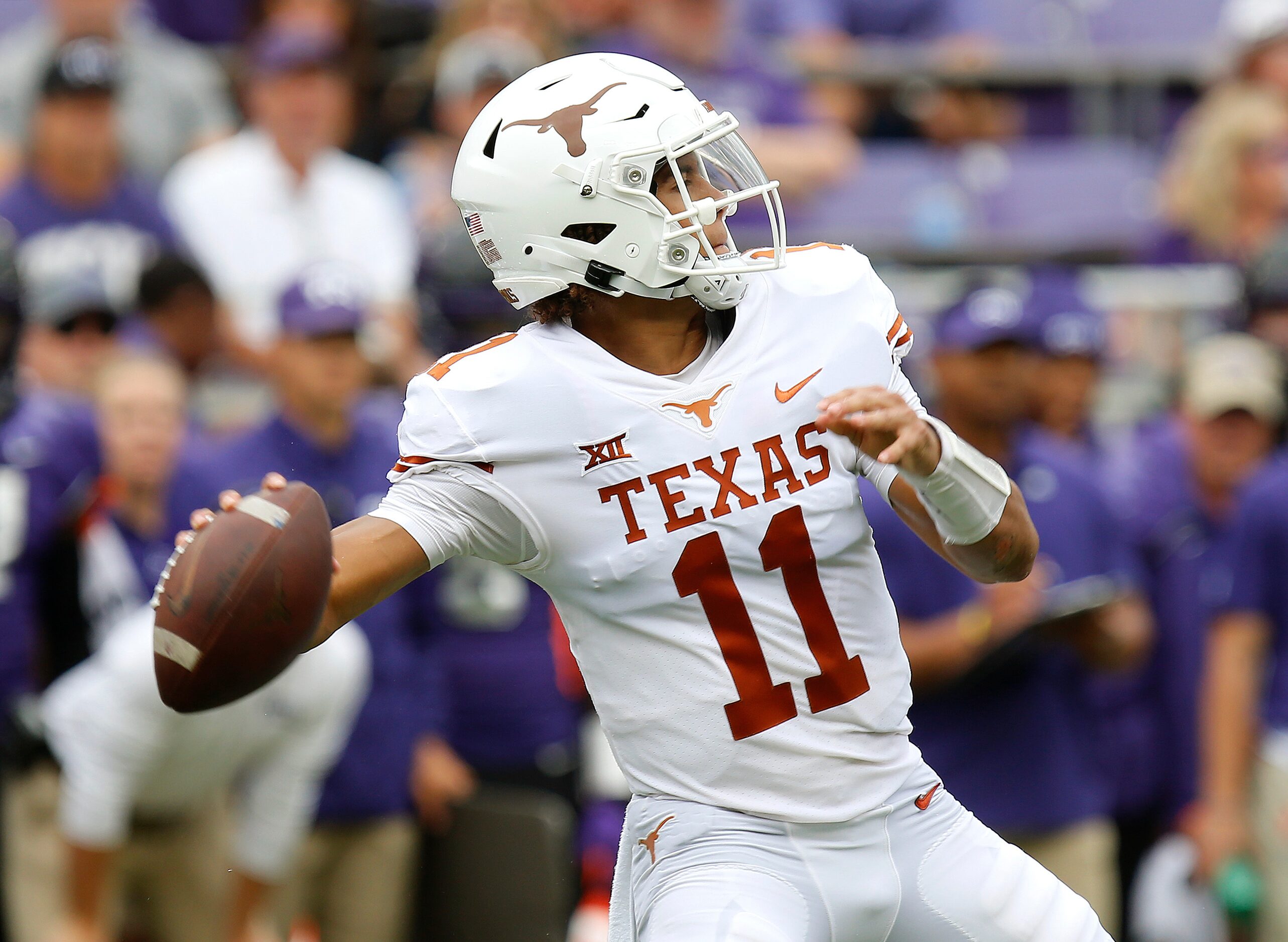 Texas Longhorns quarterback Casey Thompson (11) throws a pass during the first half as the...