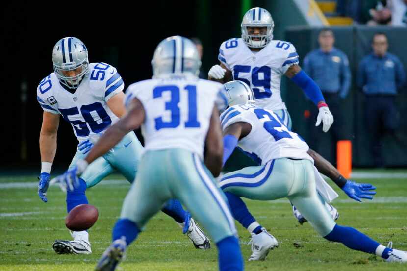 Dallas Cowboys outside linebacker Sean Lee (50) and teammates chase down a fumble by Green...