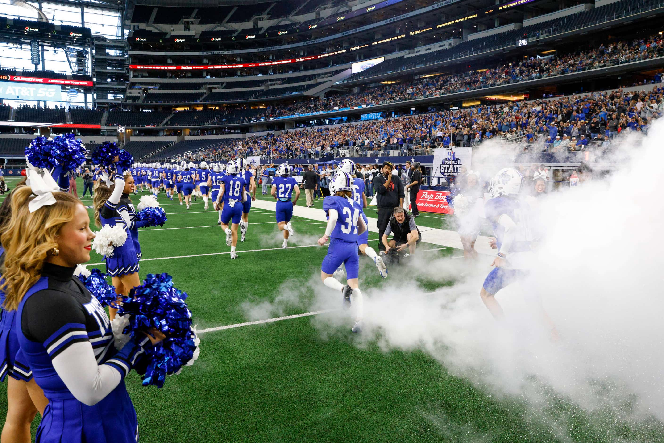 The Gunter football team takes the field before the first half of the Class 3A Division II...