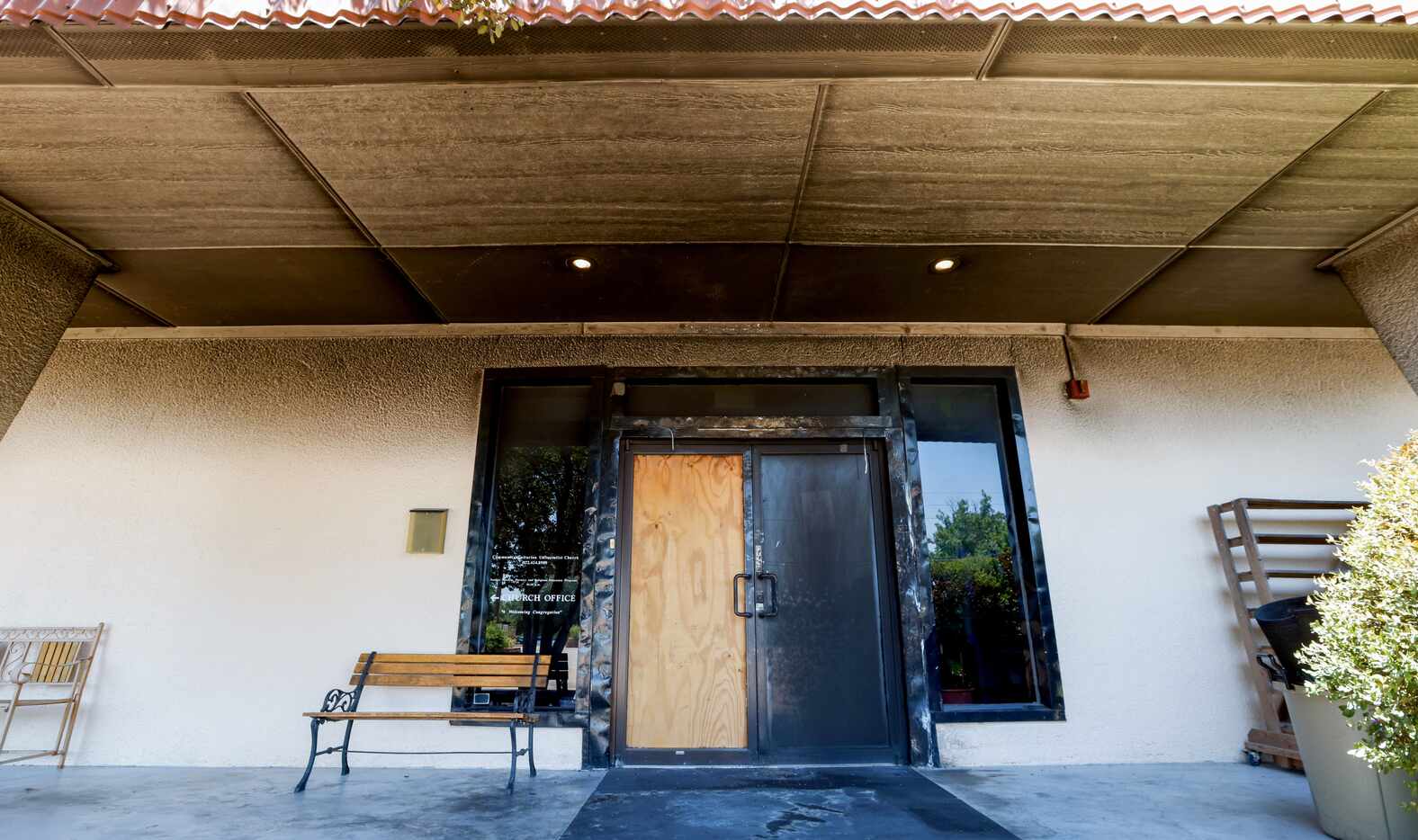 Damage to the doorway of Community Unitarian Universalist Church of Plano is visible on...