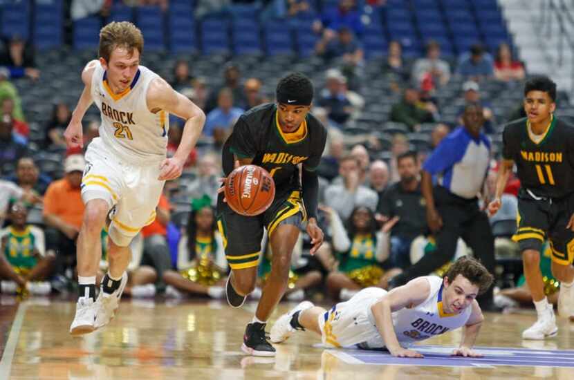 Madison's Dominique Robinson #1 is off after a steal. UIL boys basketball 3A State Final...