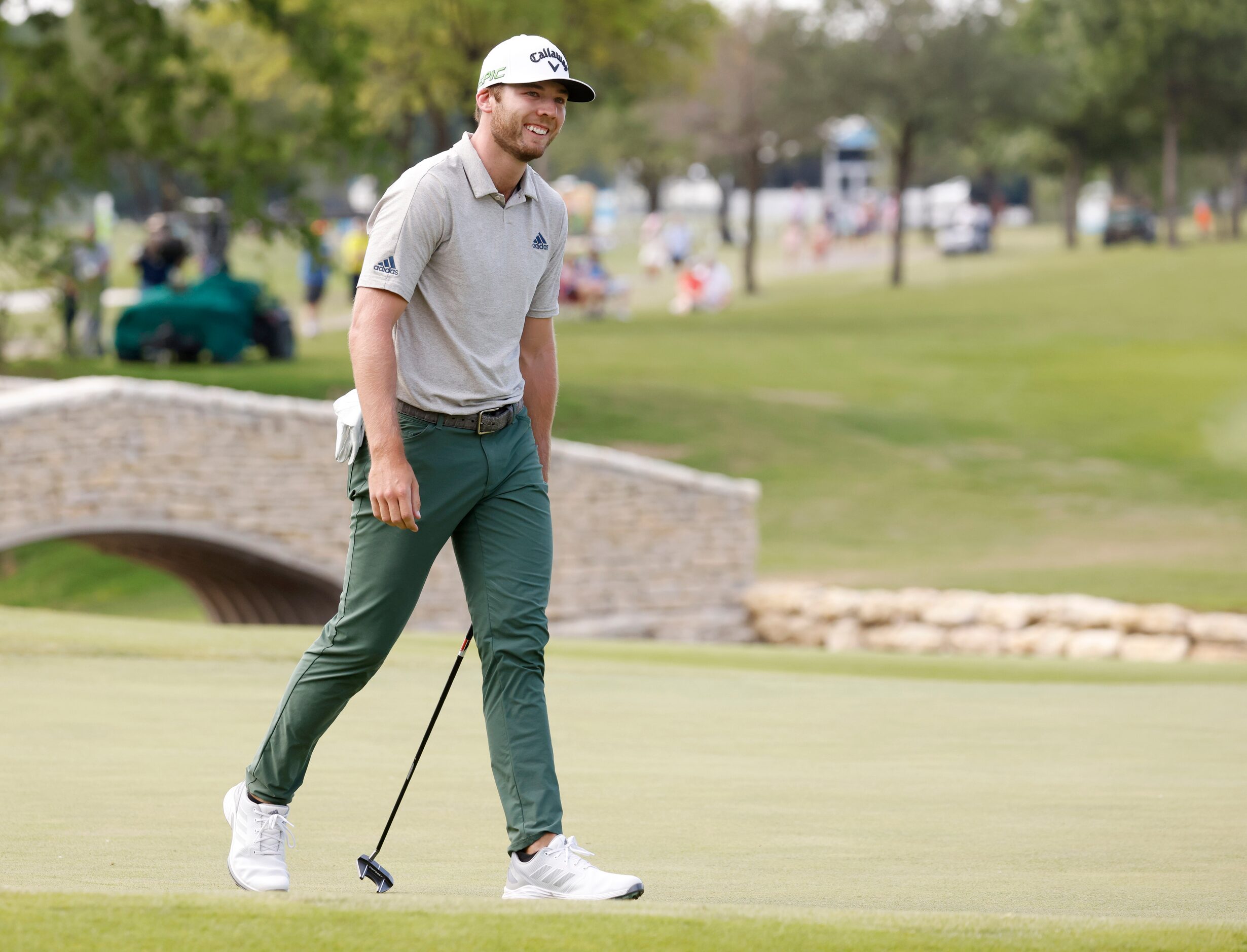 Sam Burns reacts after missing a putt for an eagle on the 18th hole during round 3 of the...