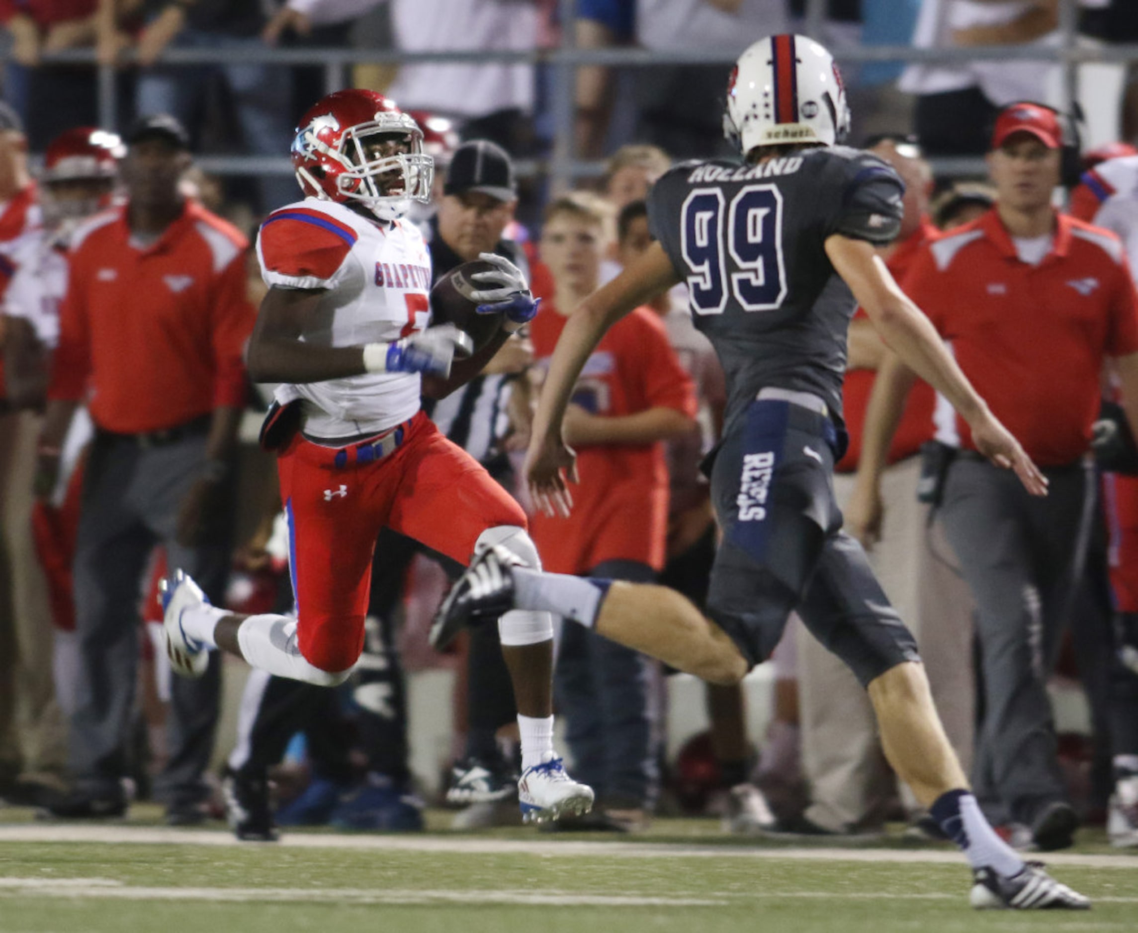 Grapevine's David Clayton (5) rambles down the sideline during a first quarter kickoff...