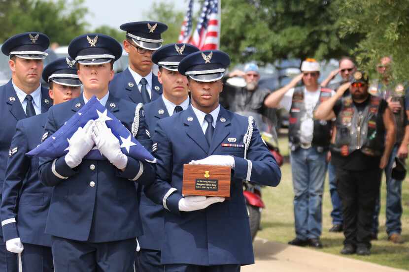 The Air Force Color Guard carried a box containing the cremated remains of Margaret King, a...