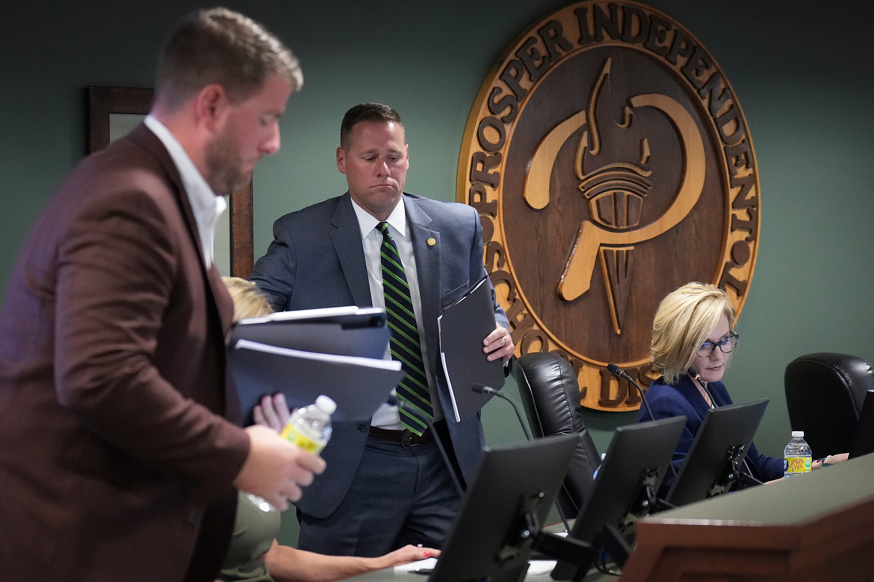 Prosper ISD board members, including Bill Beavers (center) and superintendent Holly Ferguson...