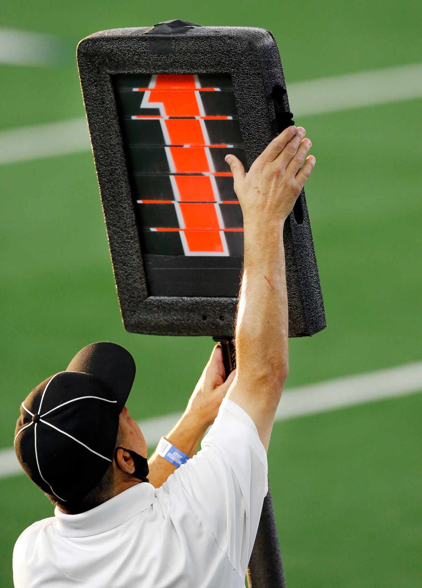 A first down is marked by an official during the Arlington Martin-Denton Ryan football game...