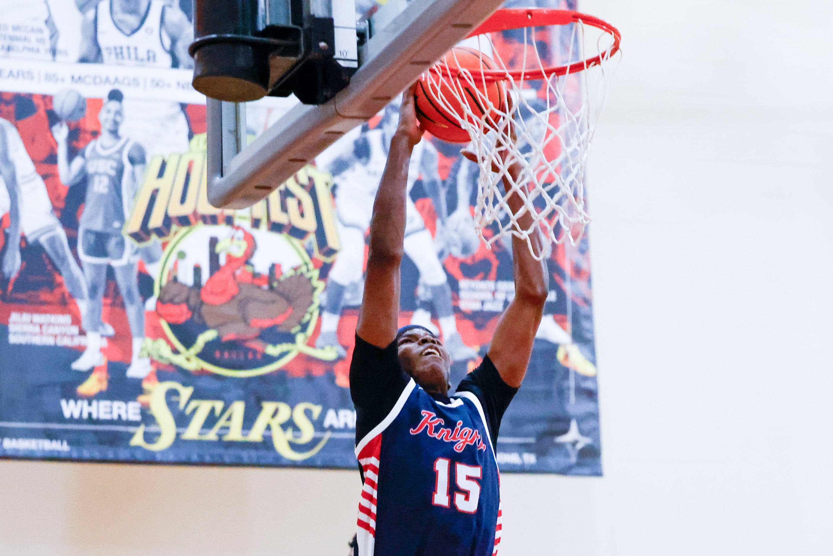 Kimball High’s Lance Carr dunks against Centennial High of California during the second half...