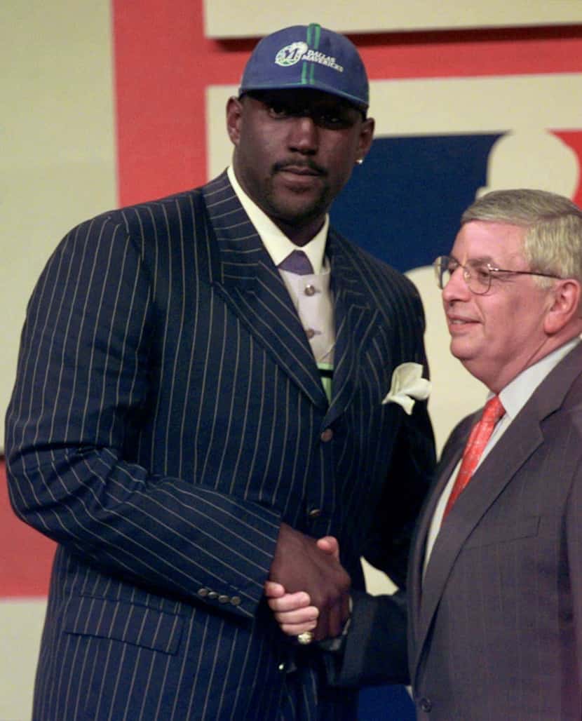 Robert Traylor shakes hands with NBA commisioner David Stern after being selected as the...
