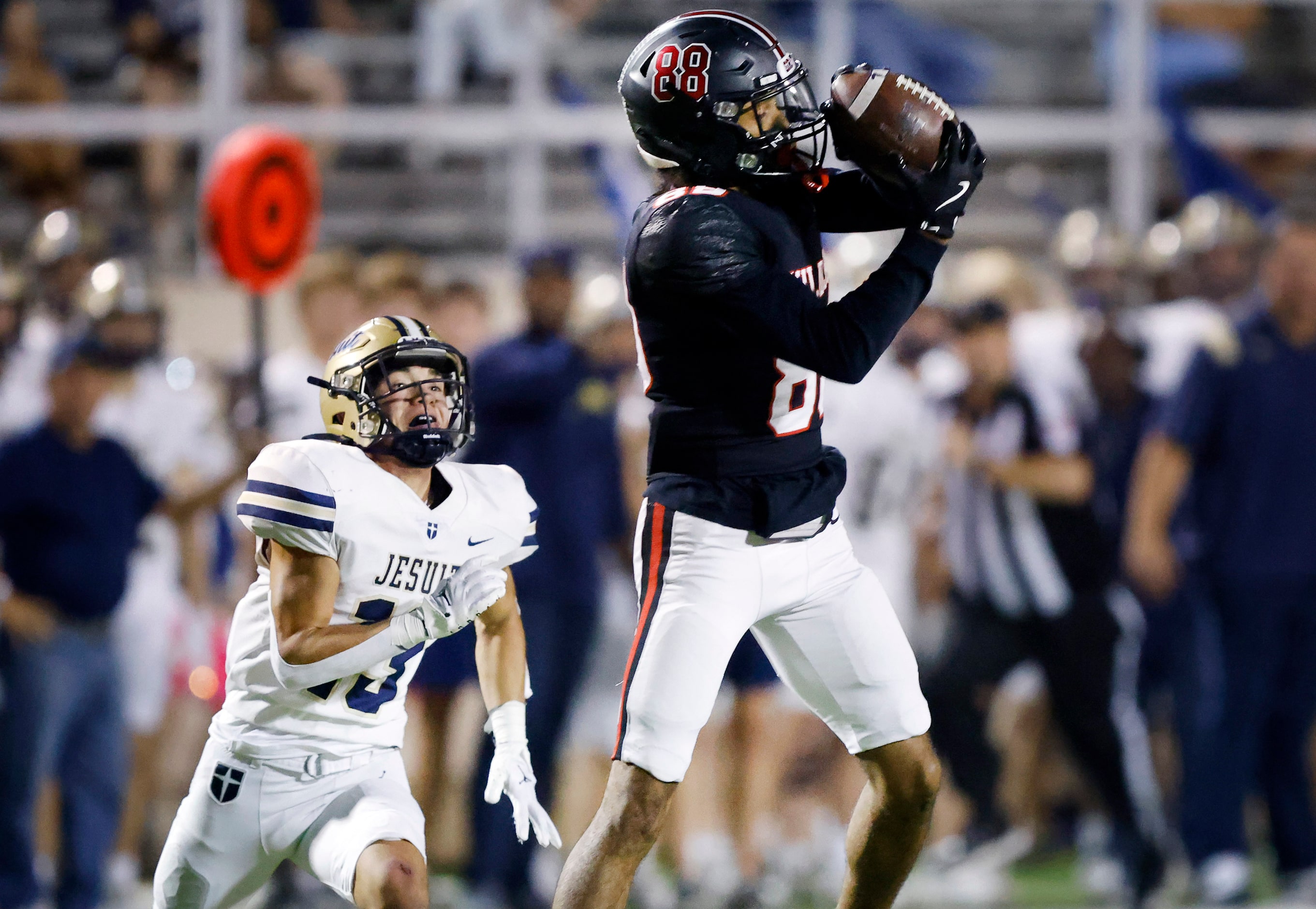 Lake Highlands High wide receiver Jordan Hutchison (88) catches a long pass across the...