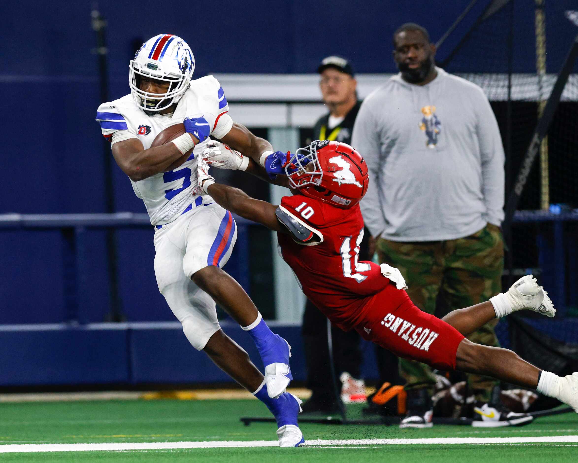 Galena Park North Shore linebacker Kent Battle (10) forces Duncanville running back Malachi...