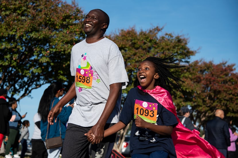 Runners approached the finish line during the Girls on the Run DFW Metroplex 5K in Grand...