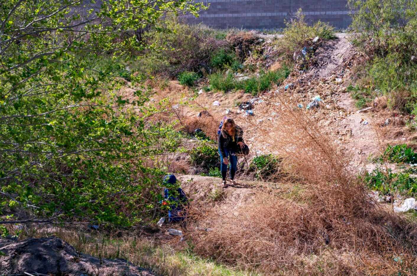 A mother and her son crossed the Rio Grande between El Paso and Ciudad Juarez, Mexico, to...