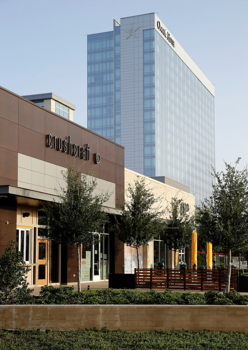 Shops in the foreground and the Omni Hotel in the background depict the  different...