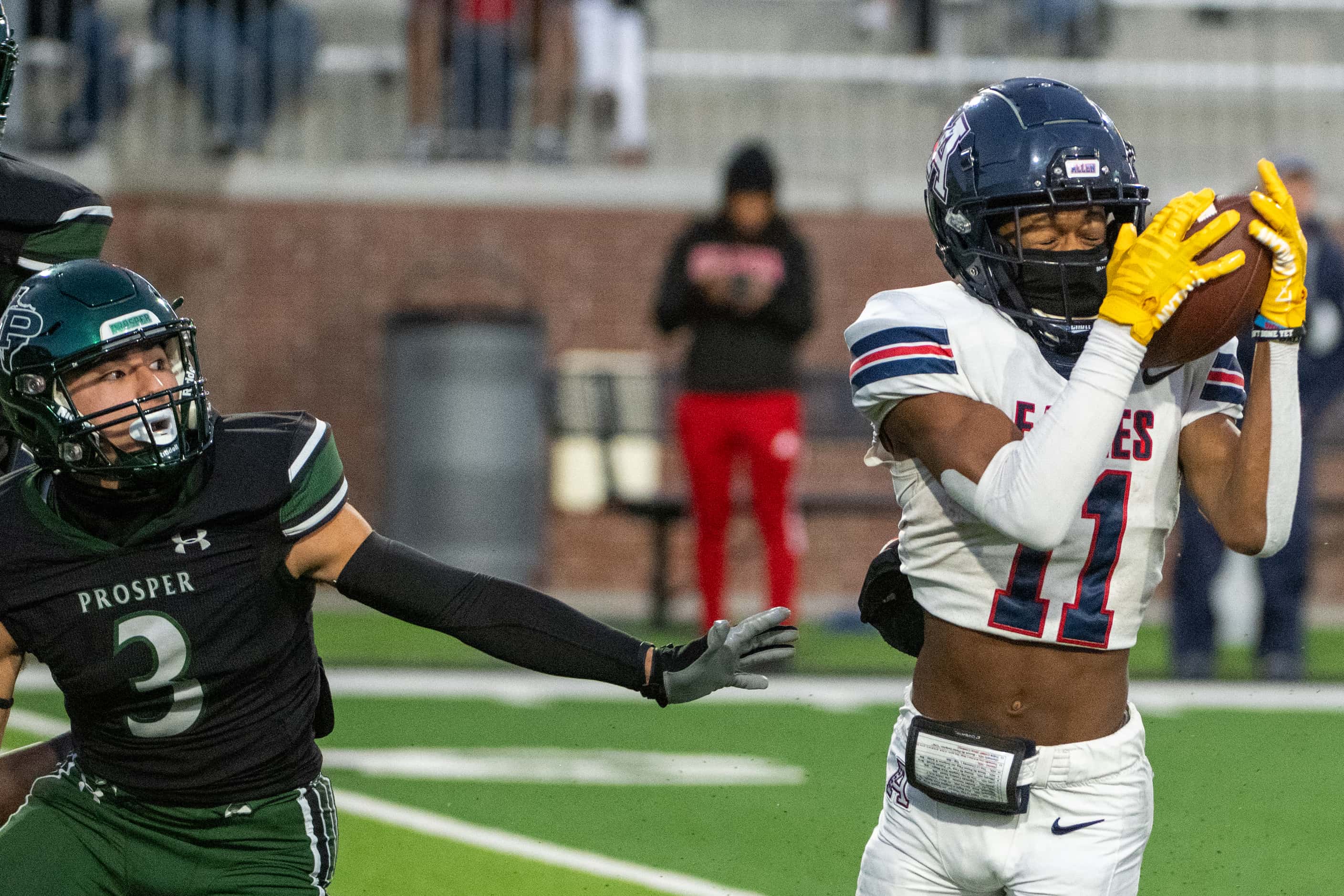 Allen’s Donnell Gee (11) catches a pass in front of Prosper's Bo Mongaras (3) In the first...