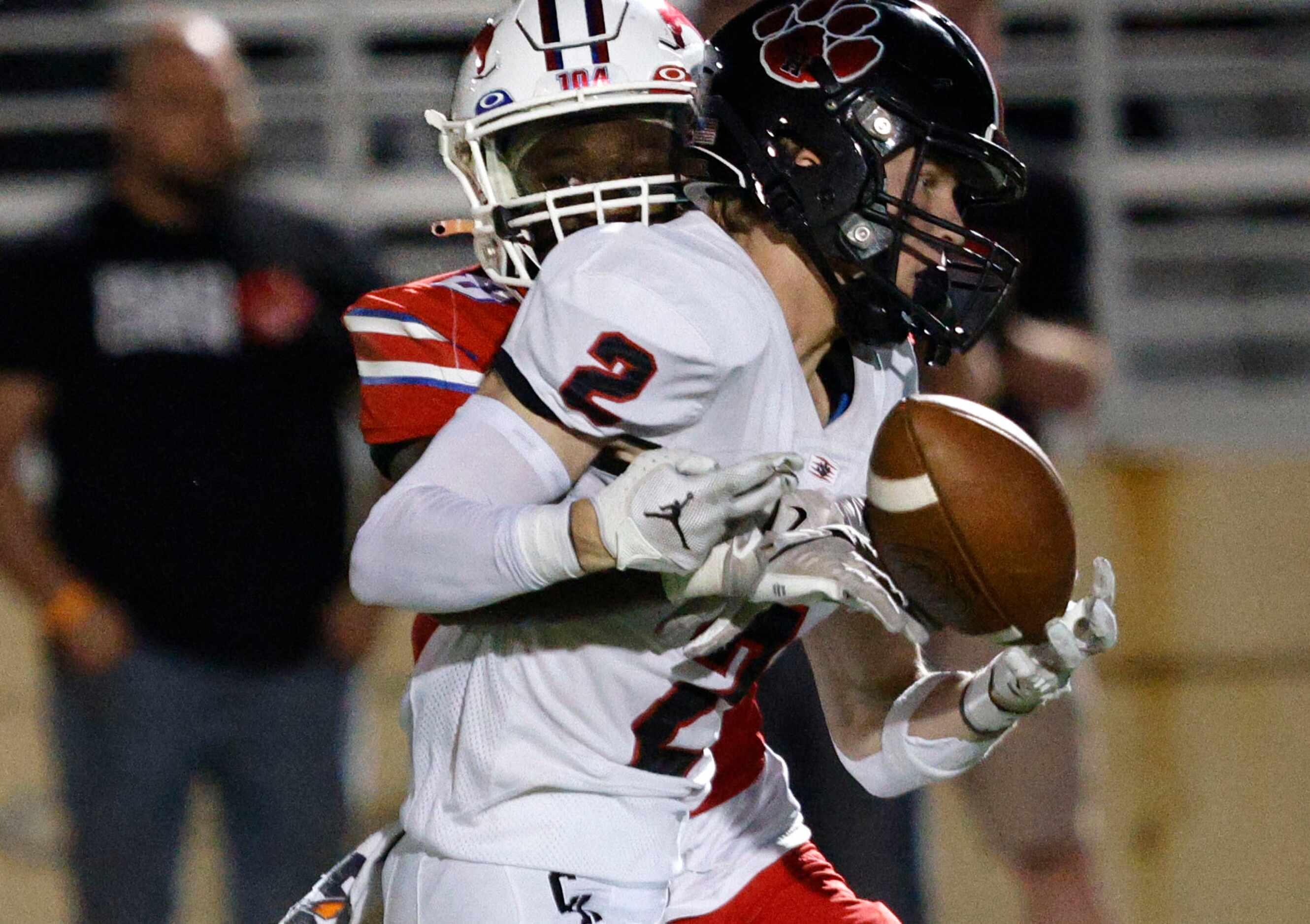 Colleyville Heritage's Zack Sogan (2) drops a ball under pressure from Grapevine's Ryan...