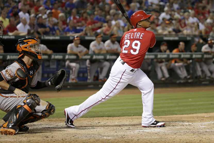Texas Rangers third baseman Adrian Beltre (29) smacks a three-run home run off Baltimore...