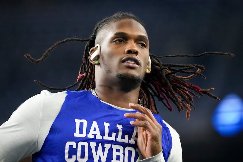 Dallas Cowboys wide receiver CeeDee Lamb warms up before an NFL football game against the...