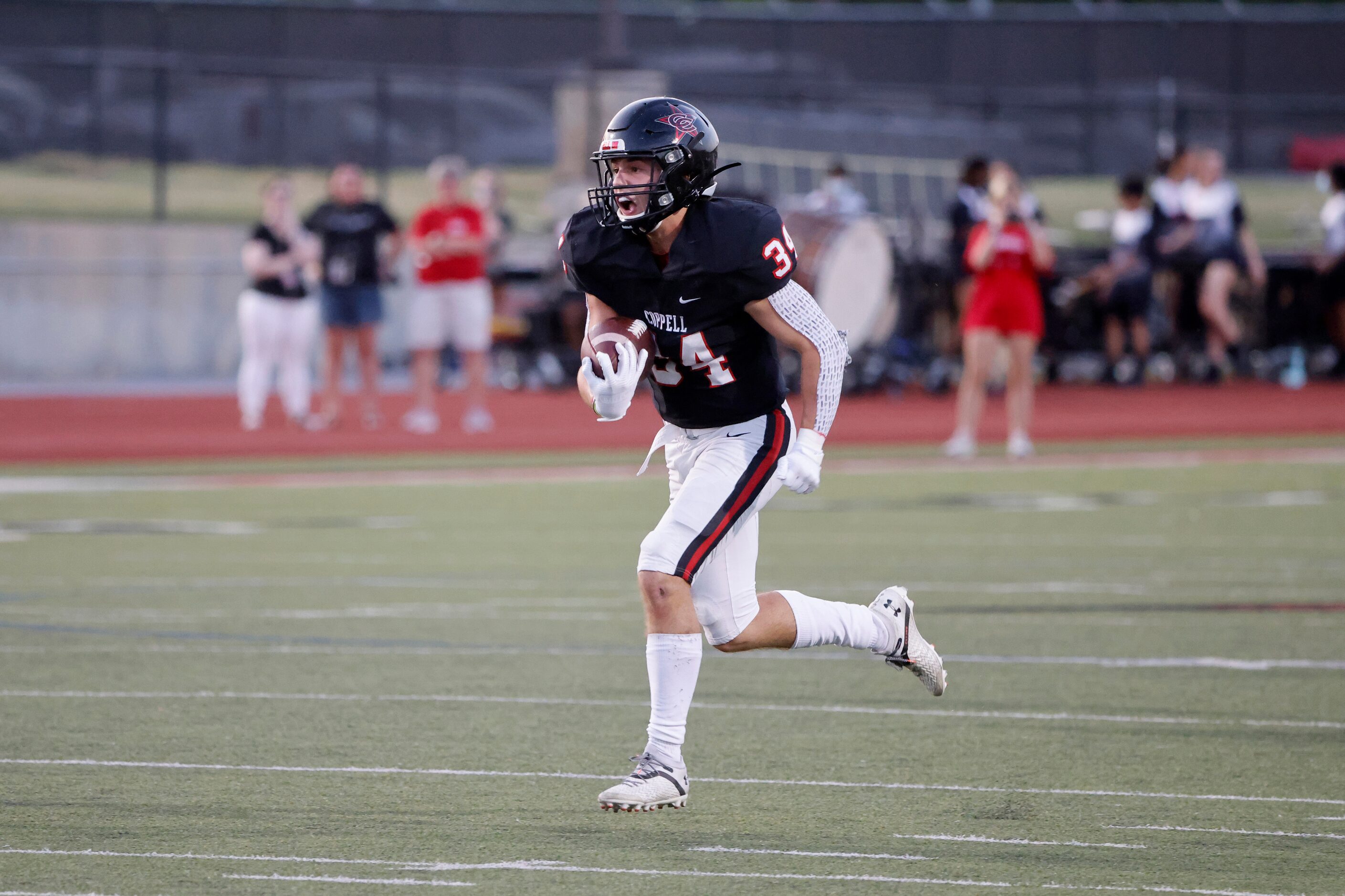 Coppell running back Blake Robbins (34) rushes against Prestonwood Christian Academy during...