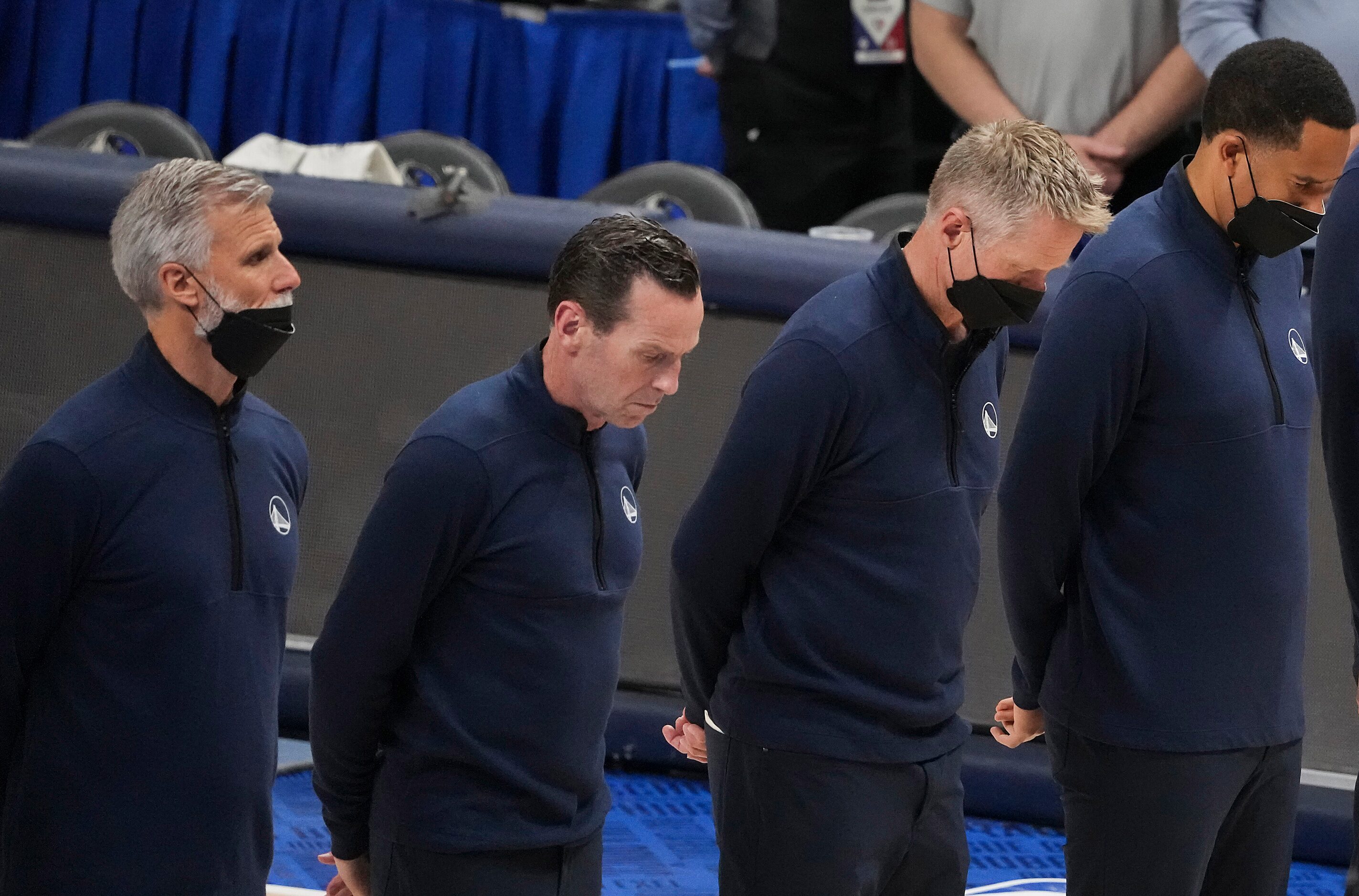 Golden State Warriors head coach Steve Kerr (second from right) stands with fellow coaches,...