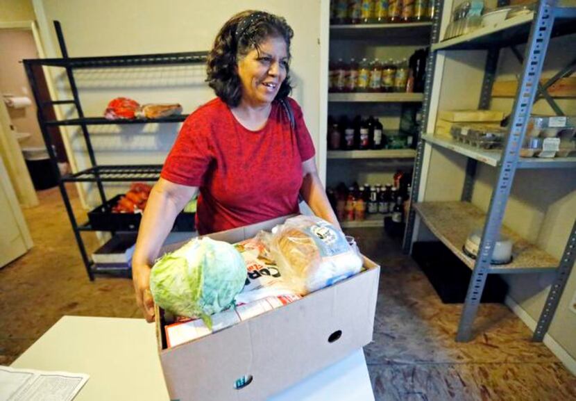 
Linda Hernandez of Wylie picked up food from the Amazing Grace Food Pantry in St. Paul. A...