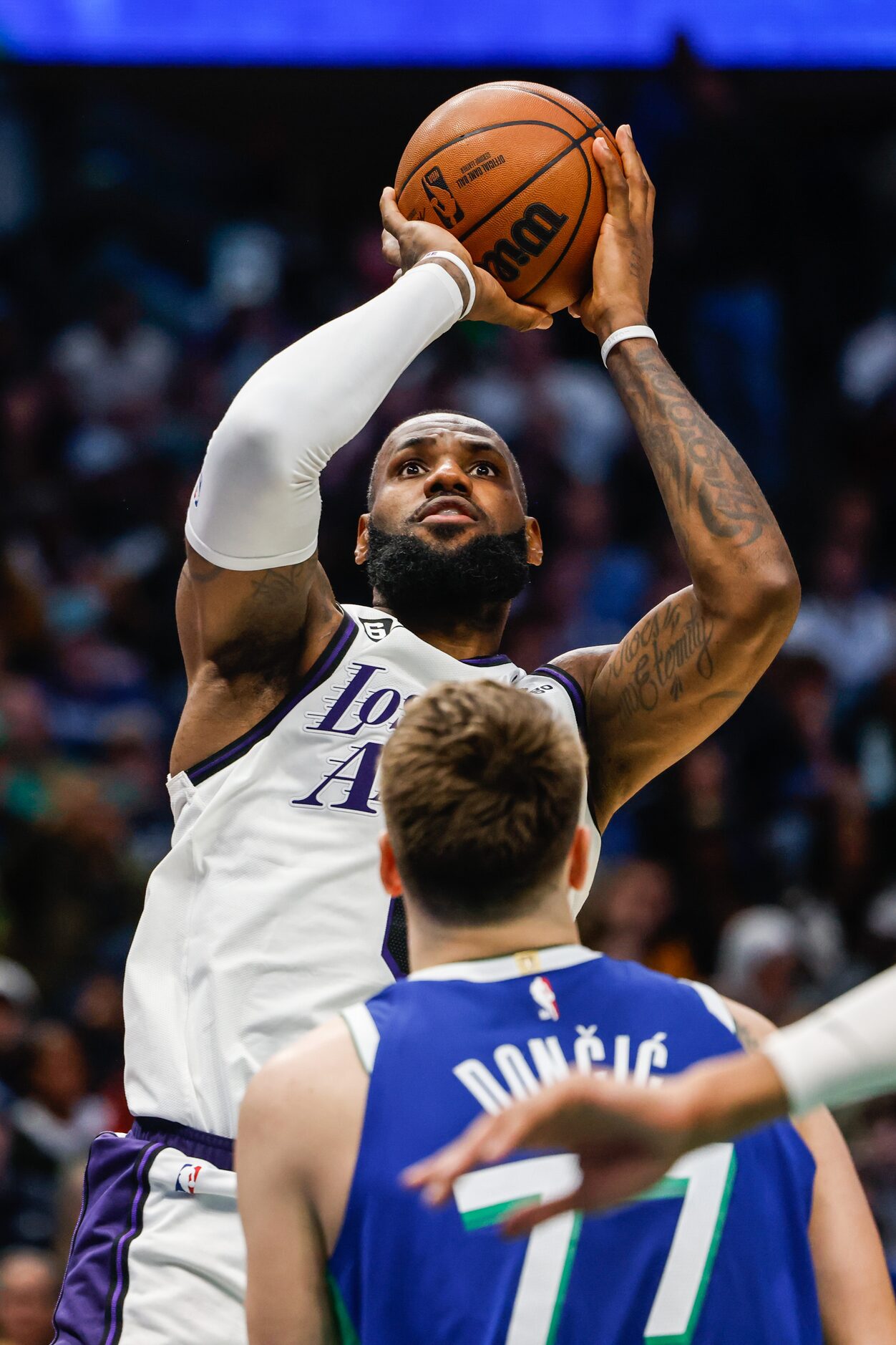 Los Angeles Lakers forward LeBron James (6) goes for a shot next to Dallas Mavericks guard...