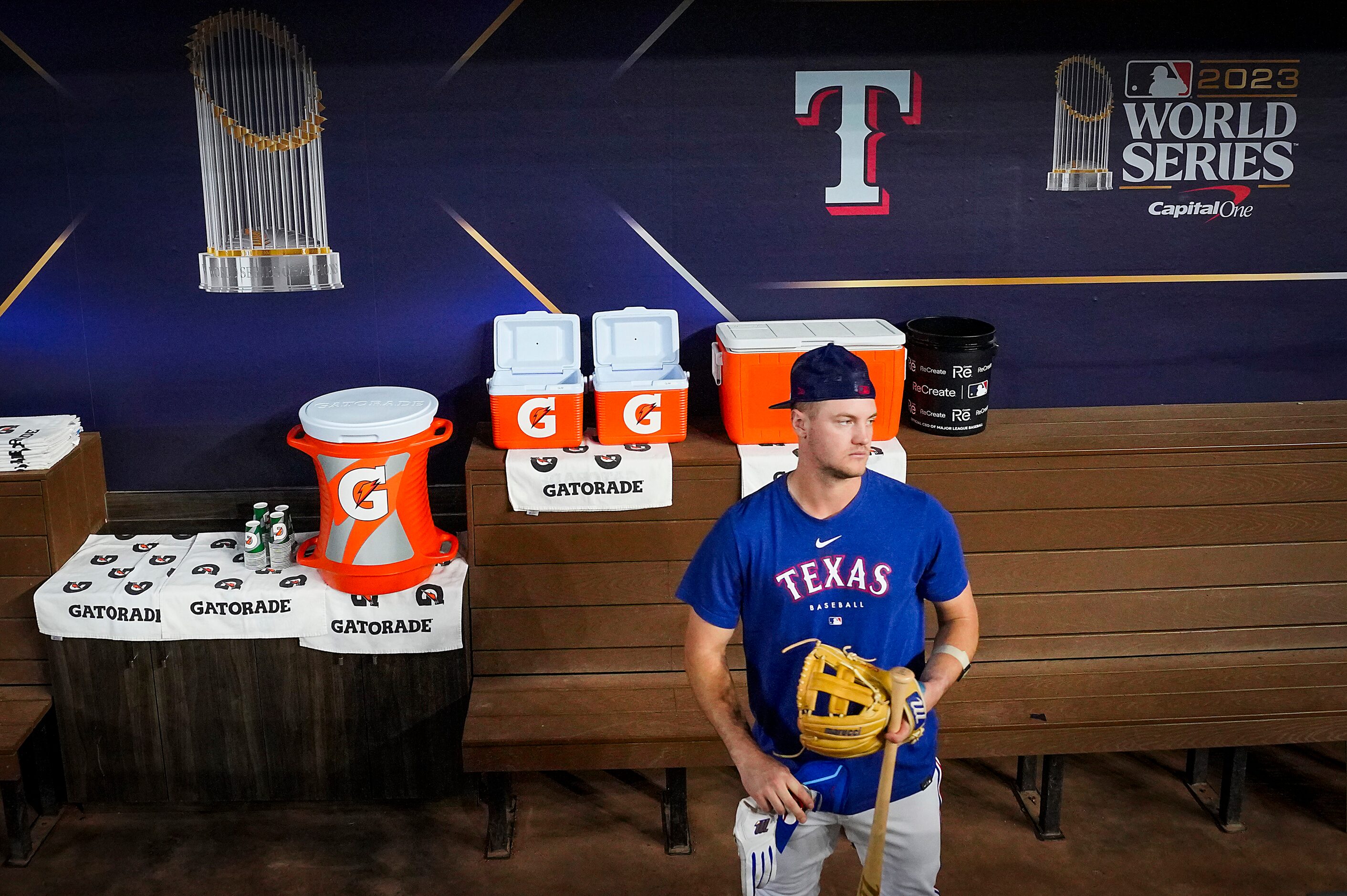 Texas Rangers third baseman Josh Jung looks out from the dugout during a team workout at...