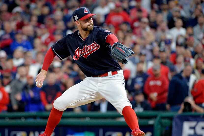 Cleveland Indians starting pitcher Corey Kluber delivers in the first inning against the New...