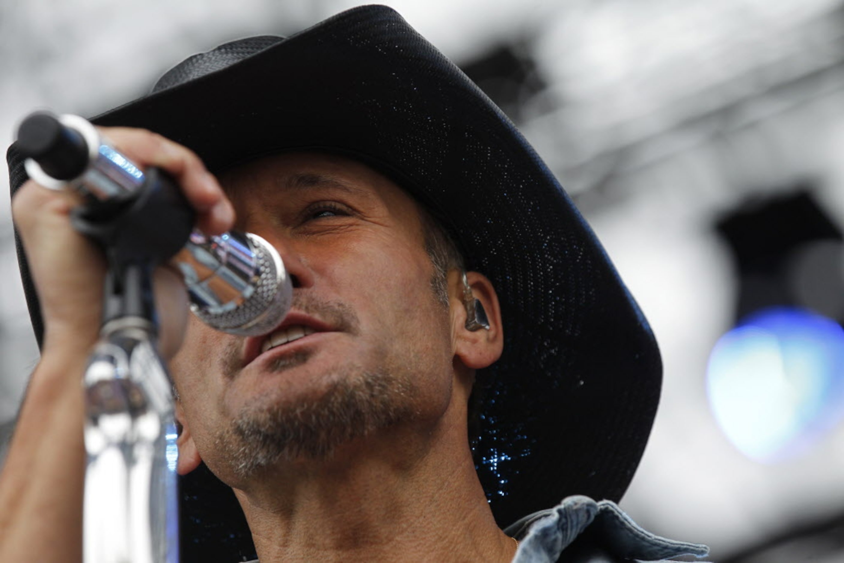 Tim McGraw sings during his performance at the March Madness Music Festival at Reunion Park...