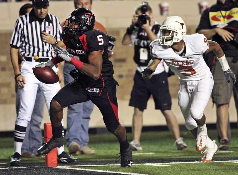 FILE - In this Nov. 1, 2008, file photo, Texas Tech receiver Michael Crabtree steps into the...