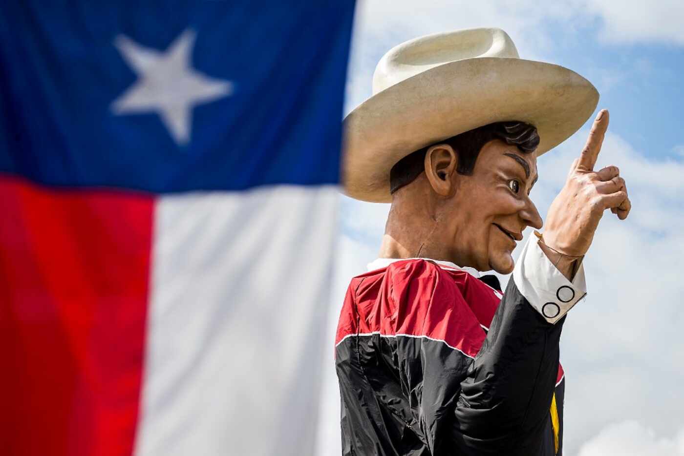 Big Tex looks down over Fair Park while being installed on Friday. The State Fair of Texas...