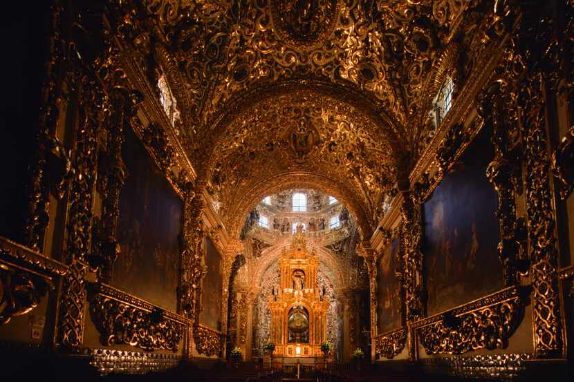 The Rosary Chapel at the Church of Santo Domingo is a breathtaking room, with gold-leafed...