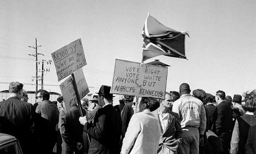 In this Nov. 22, 1963 file photo, people, including right-wing protesters carrying a...