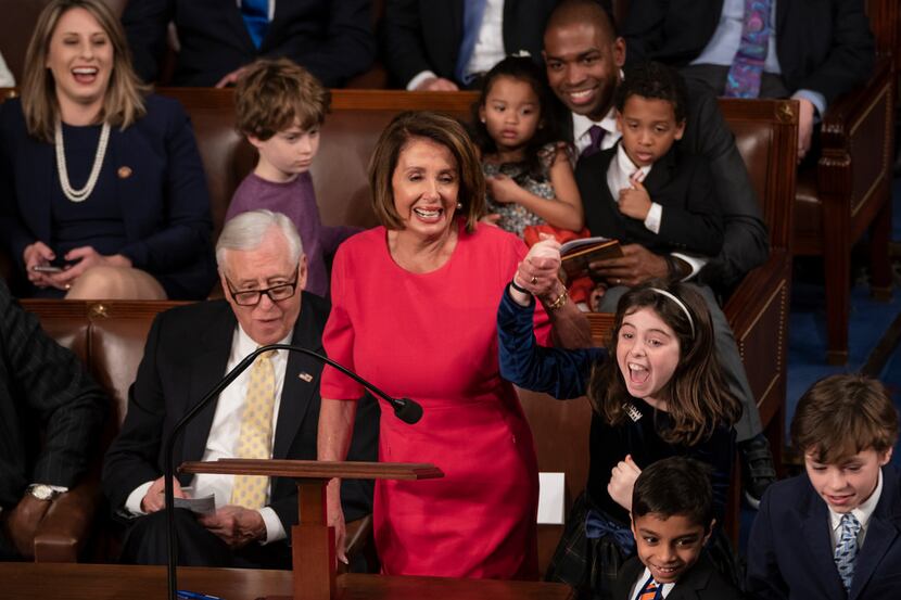 With some enthusiastic assistance from her grandchildren, House Democratic leader Nancy...