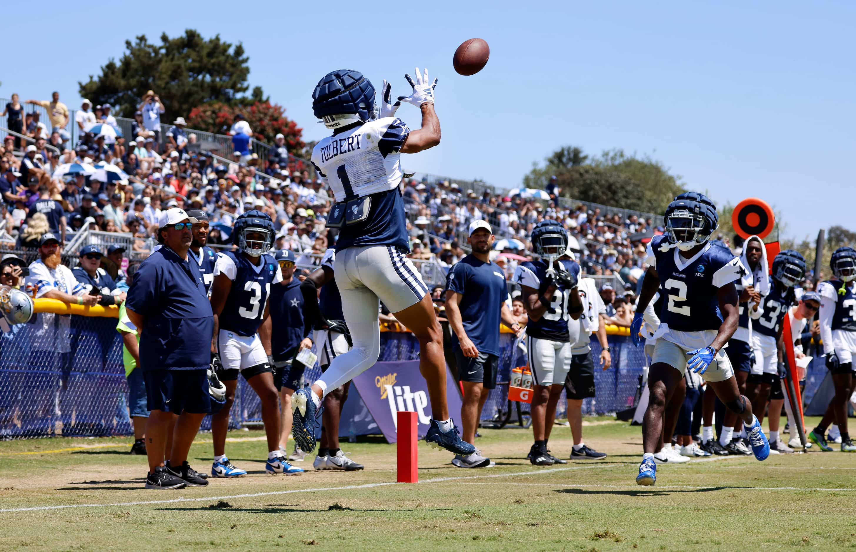 Dallas Cowboys wide receiver Jalen Tolbert (1) hauls in a touchdown pass in front of...