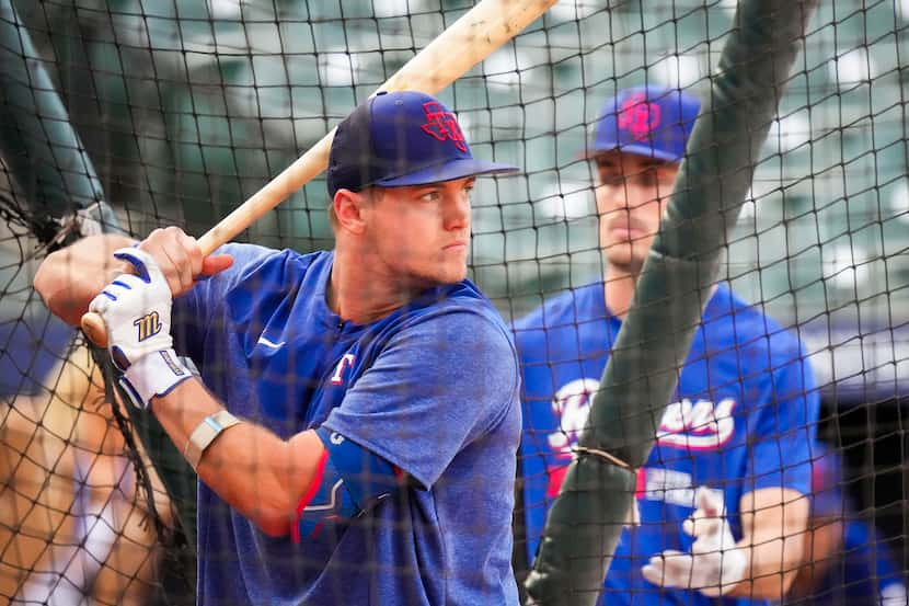 Texas Rangers third baseman Josh Jung takes batting practice during a team workout at Oriole...